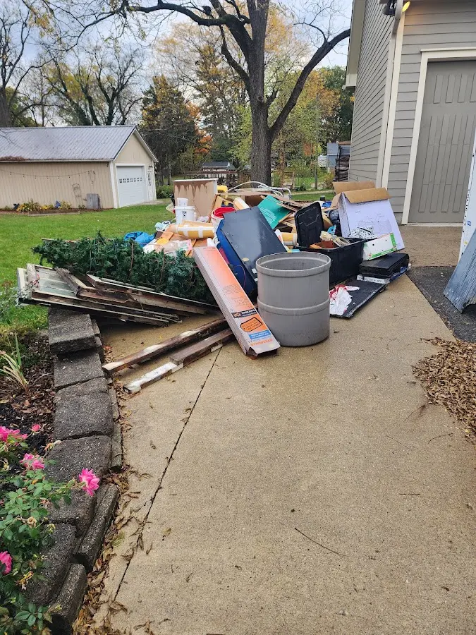 Dumpster being loaded with debris for 3 Yard Dumpster Rental in Yukon
